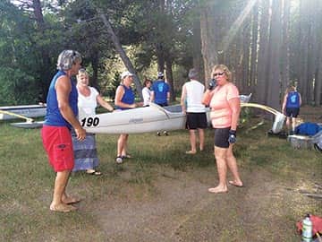 081315-TahoeTime_Loading-in-Outrigger-board-members